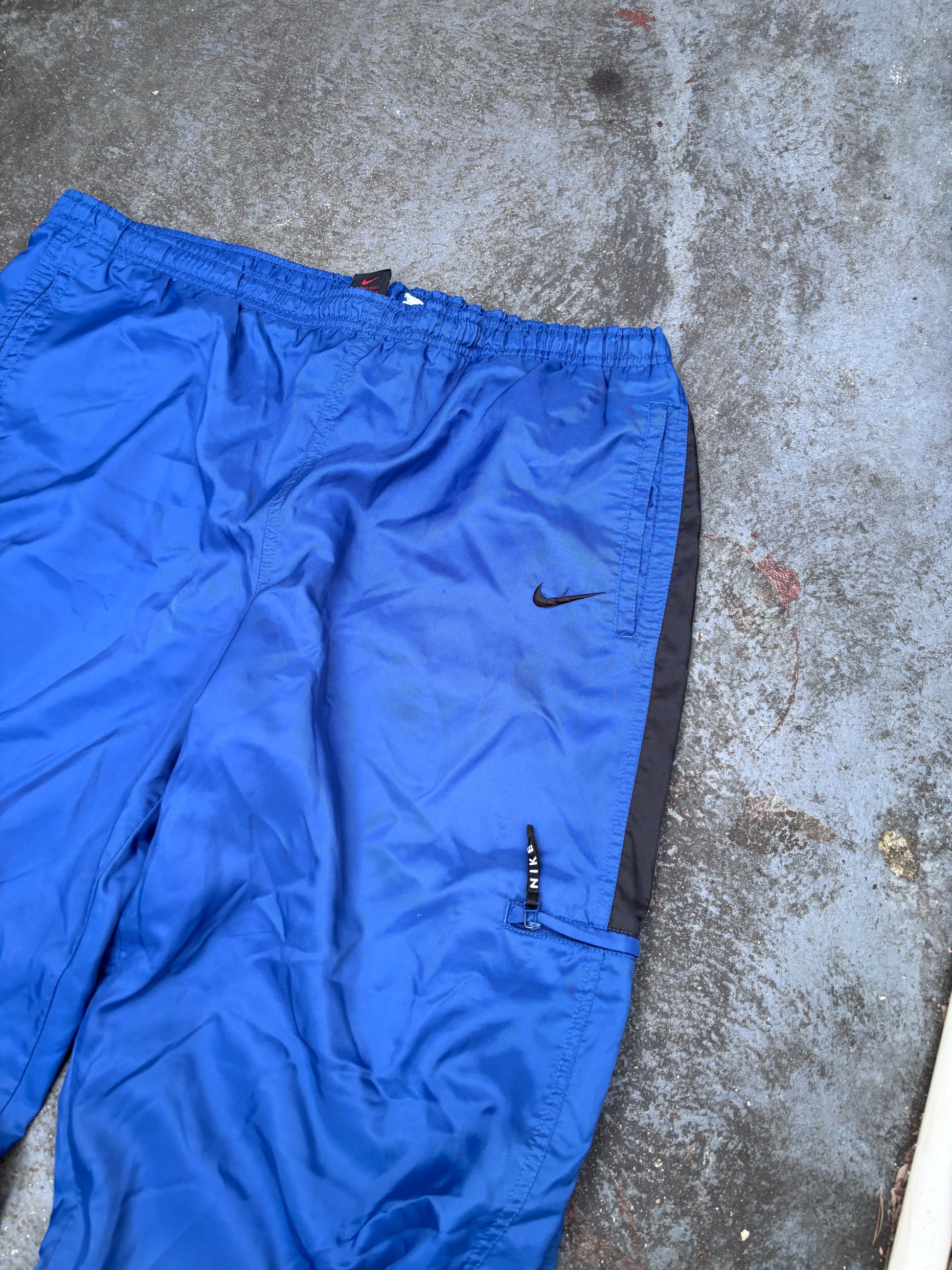 Vintage 90s Nike Track Pants Size XL Blue Black Swoosh Spell Out Logo Classic Windbreakers