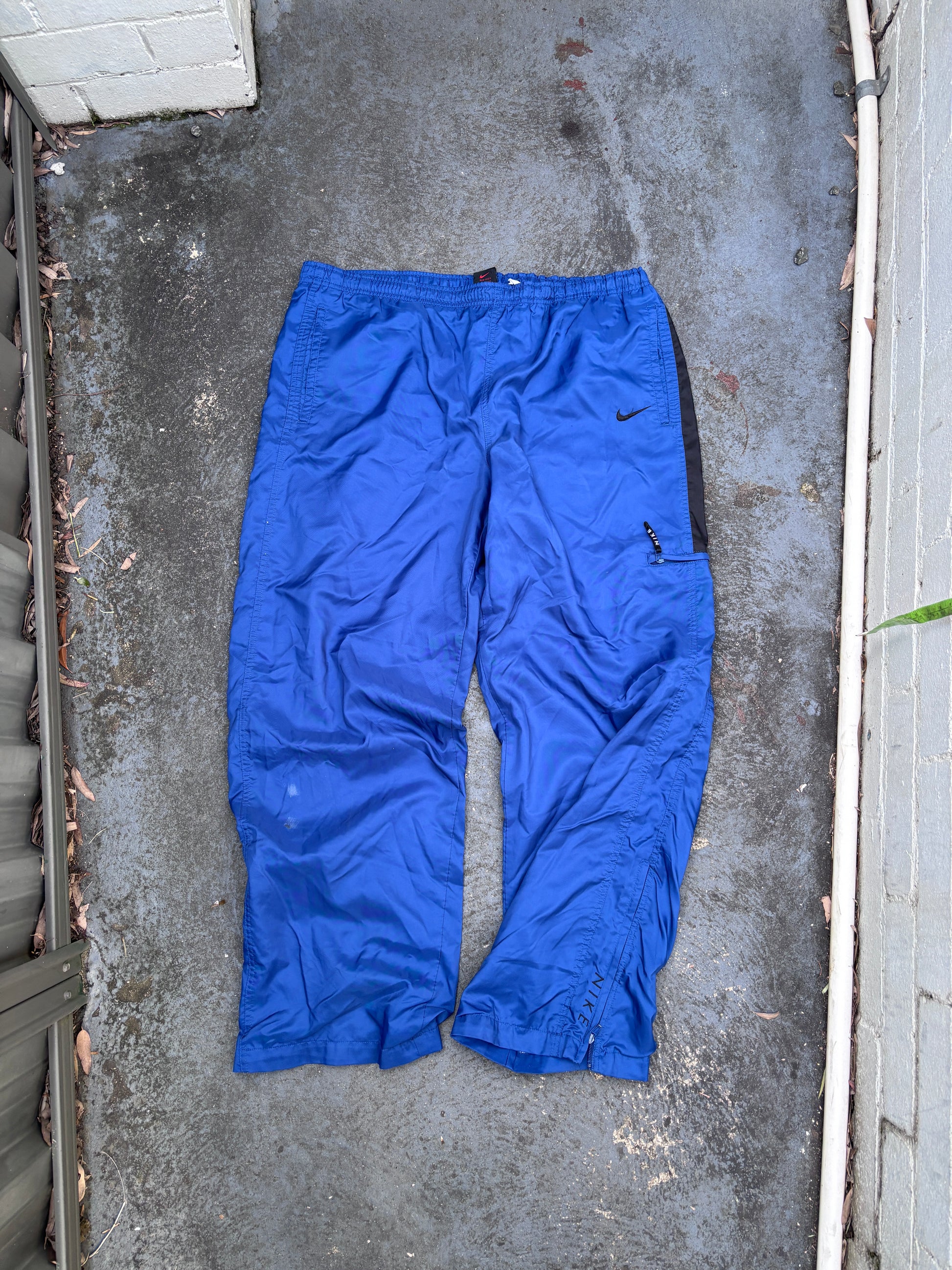 Vintage 90s Nike Track Pants Size XL Blue Black Swoosh Spell Out Logo Classic Windbreakers