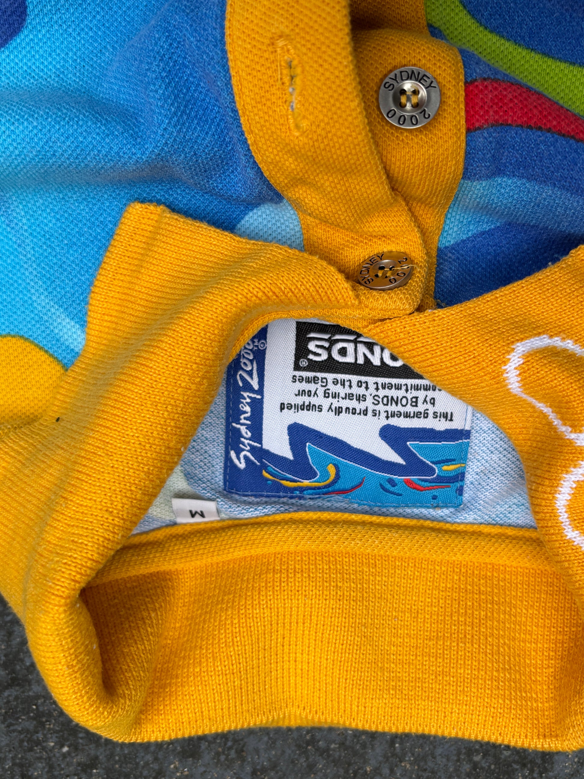 Vintage Y2K Bonds Sydney Olympics Polo Shirt Size M Multi 2000 All Over Graphic