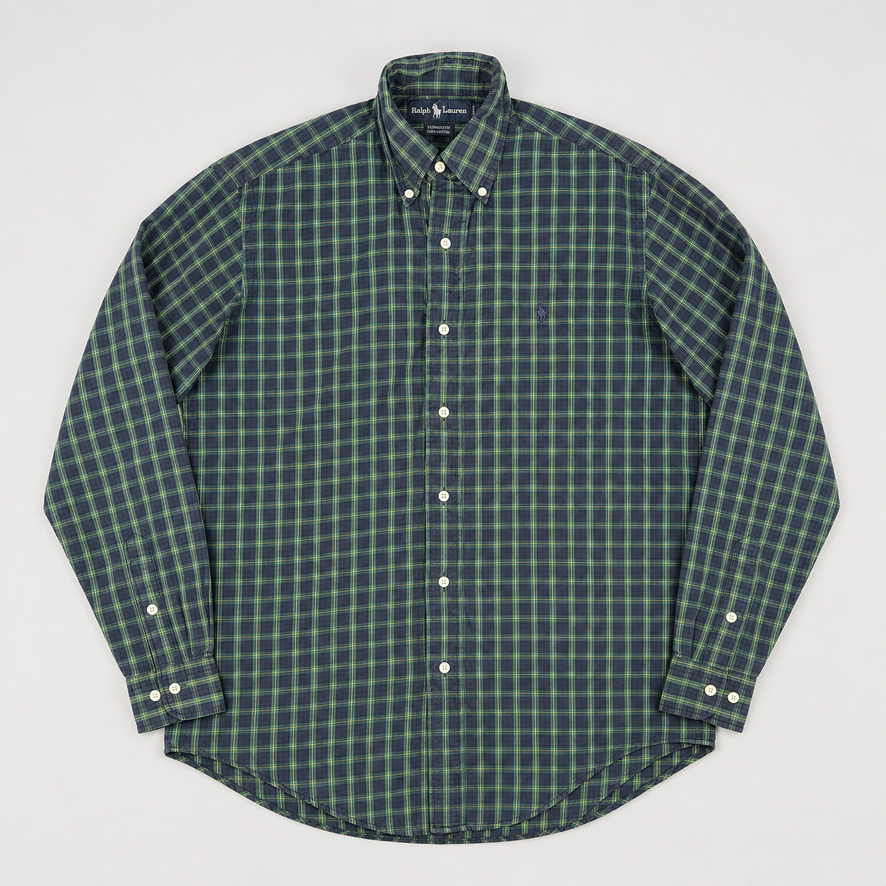 A long-sleeve button-down shirt by Ralph Lauren, featuring a green and dark gray plaid pattern, laid flat on a light gray background.