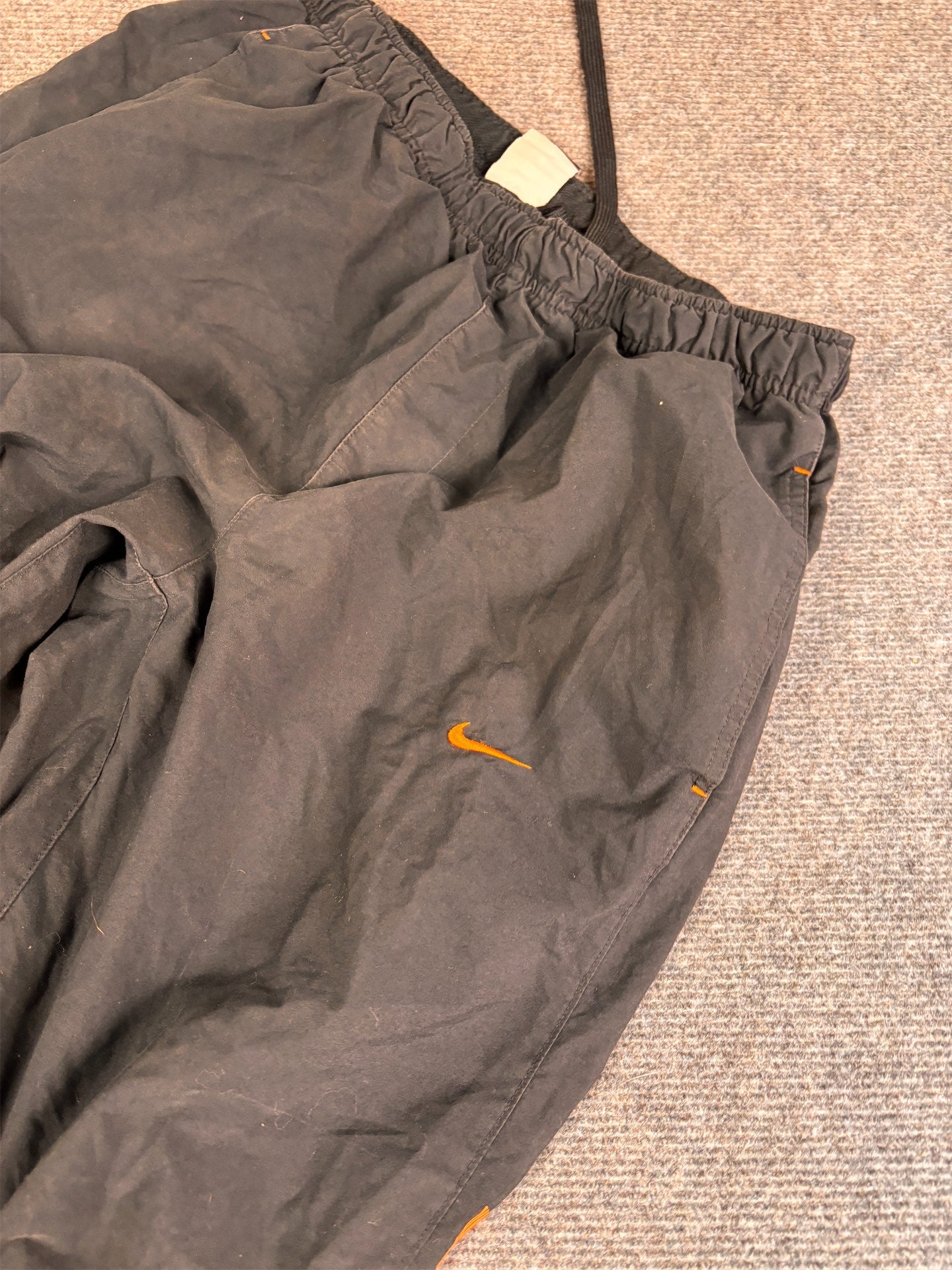 Men's Classic Nike Track Pants Size M Black Orange Piping Swoosh Spell Out Logo Cuffed Ankles Wide Leg