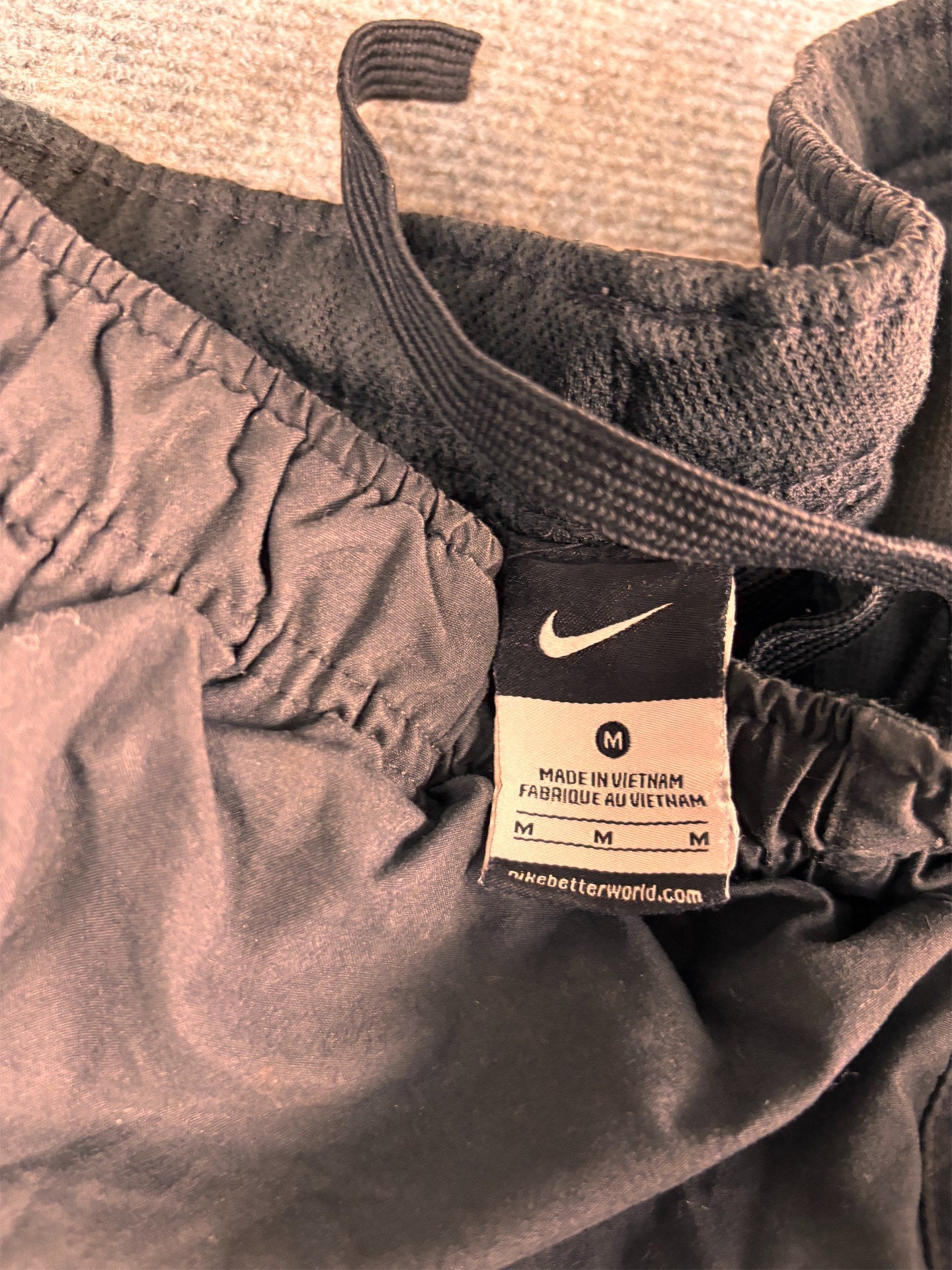 Men's Classic Nike Track Pants Size M Black Orange Piping Swoosh Spell Out Logo Cuffed Ankles Wide Leg