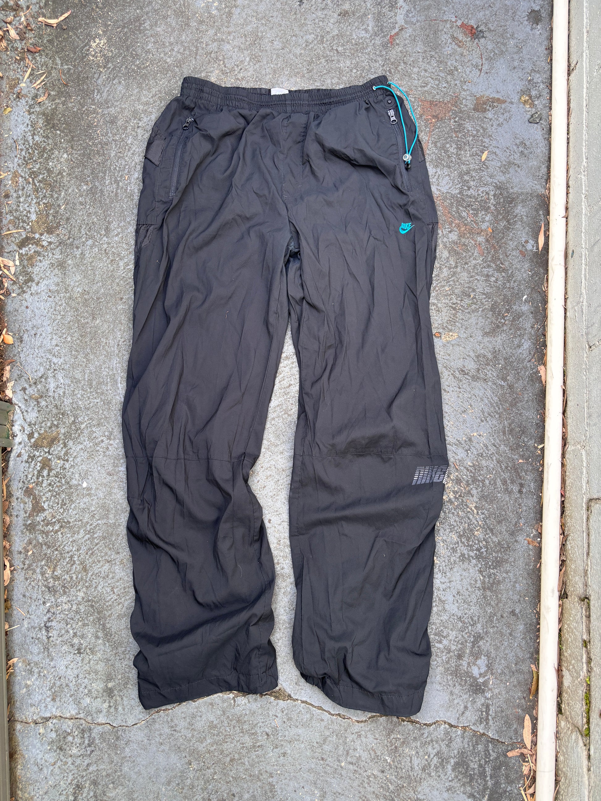 Vintage Y2K Nike Track Pants Fits L/XL Black Blue Nike Air Spell Out Bungee Tabs Nylon