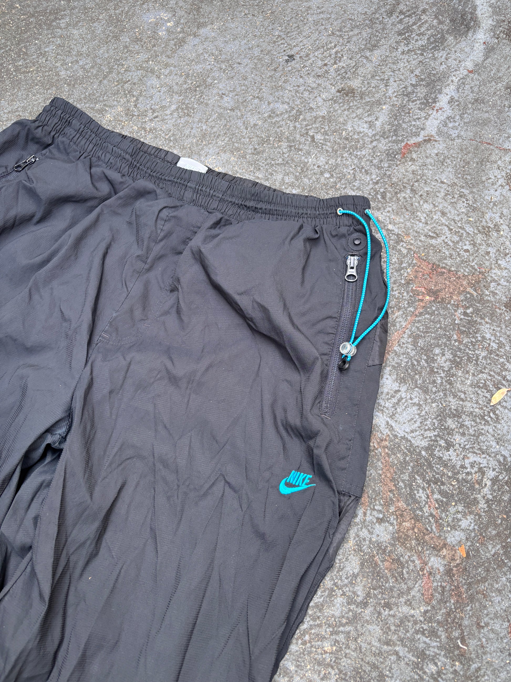 Vintage Y2K Nike Track Pants Fits L/XL Black Blue Nike Air Spell Out Bungee Tabs Nylon