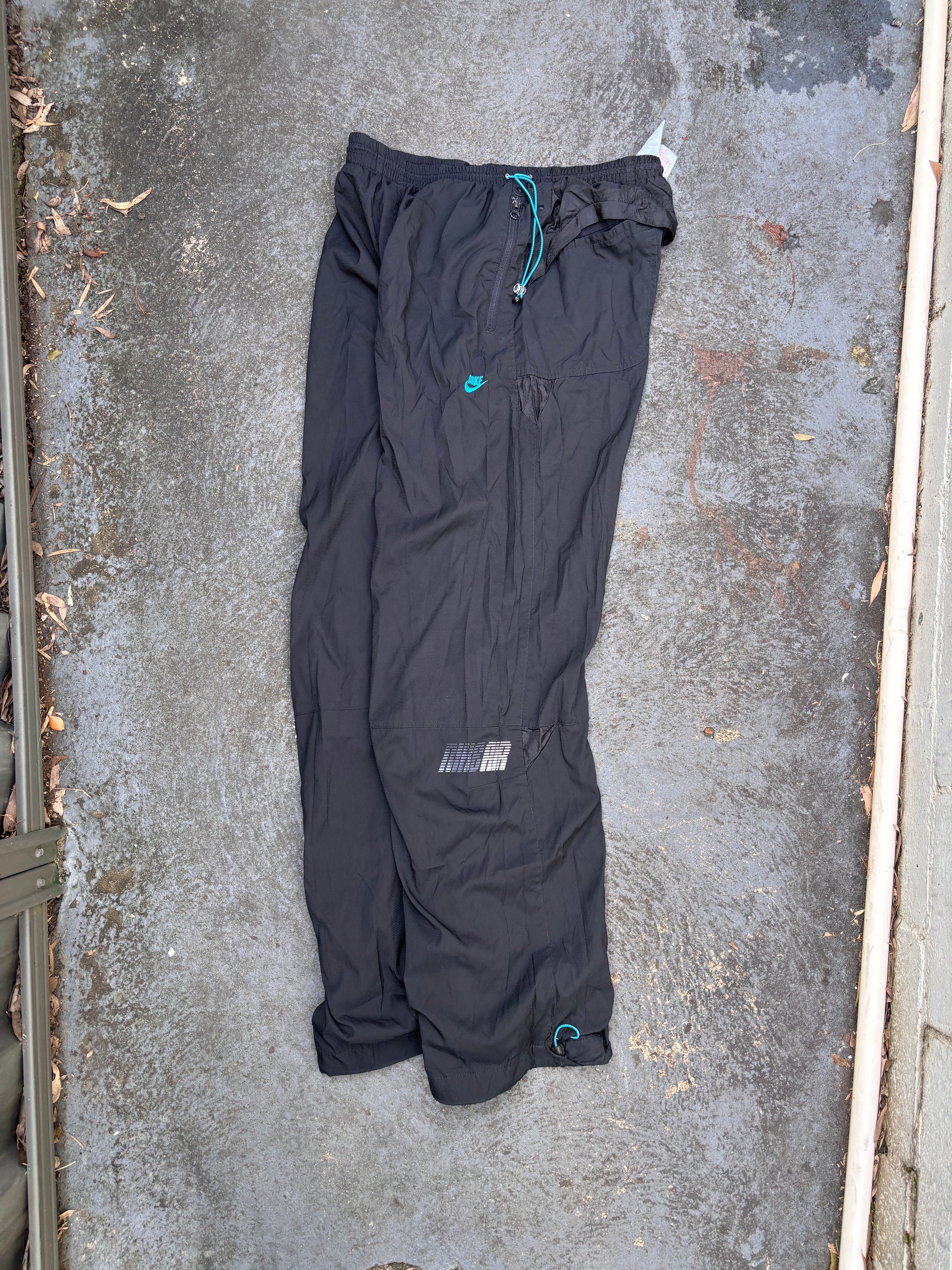 Vintage Y2K Nike Track Pants Fits L/XL Black Blue Nike Air Spell Out Bungee Tabs Nylon