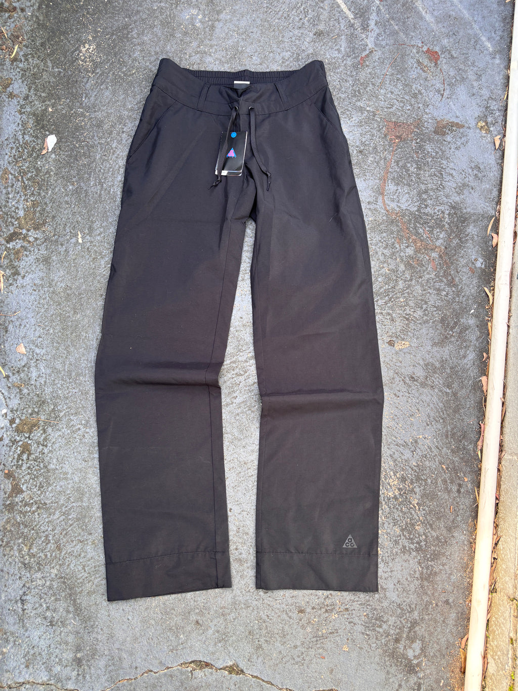 Nike ACG Pants Womens S Black Ankle Logo Wide Leg Windbreaker Chinos NWT