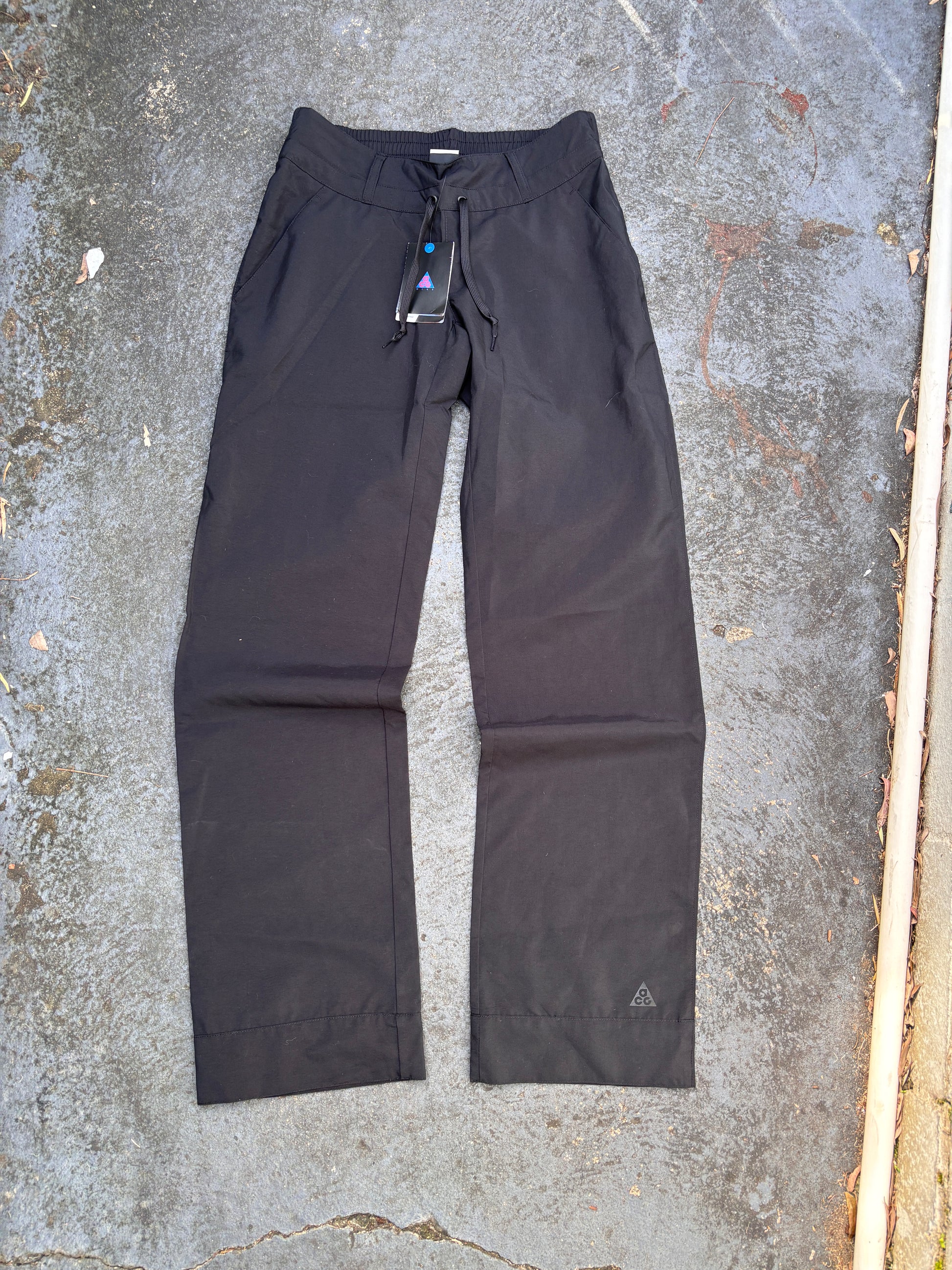 Nike ACG Pants Womens S Black Ankle Logo Wide Leg Windbreaker Chinos NWT