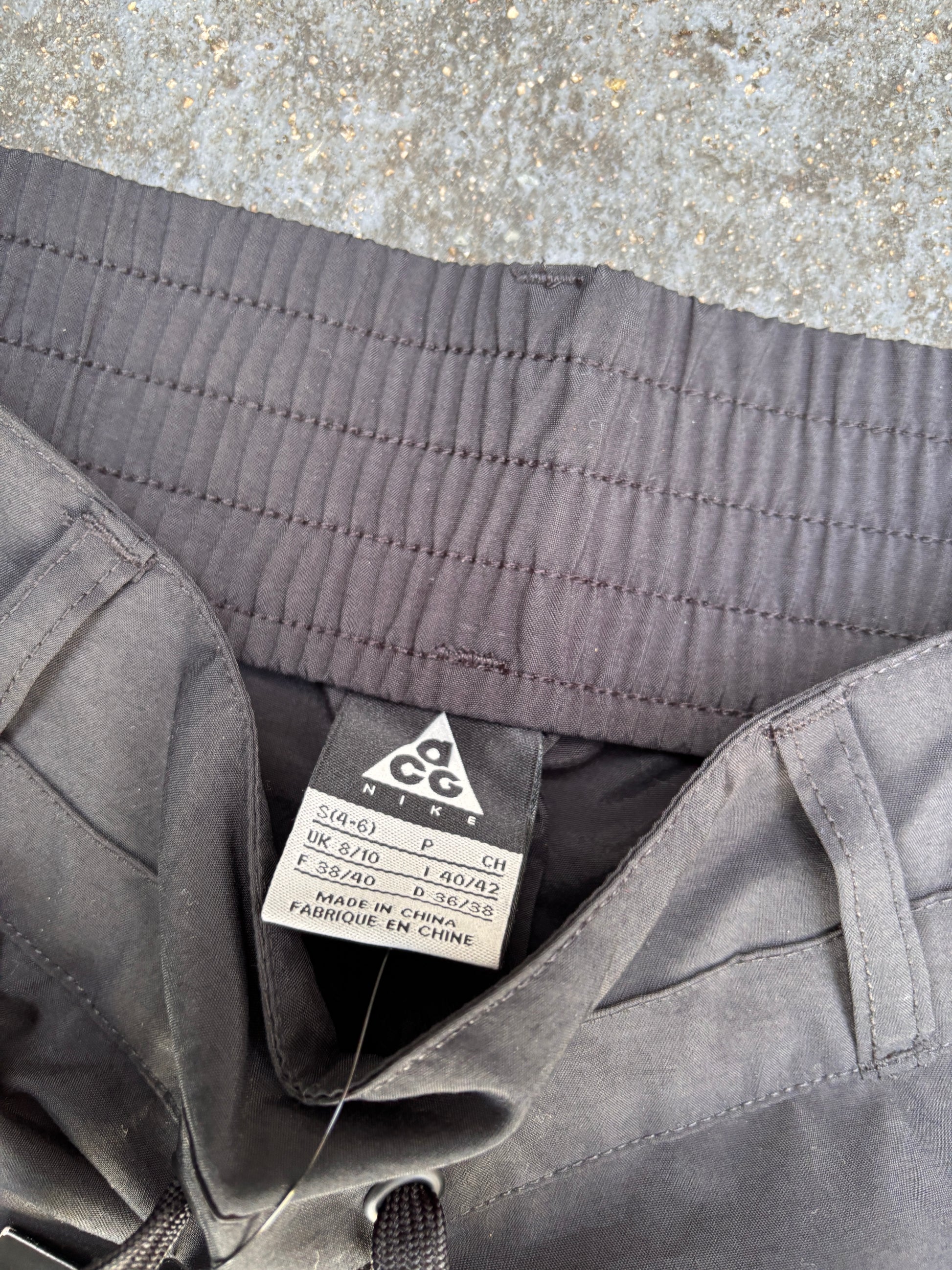 Nike ACG Pants Womens S Black Ankle Logo Wide Leg Windbreaker Chinos NWT