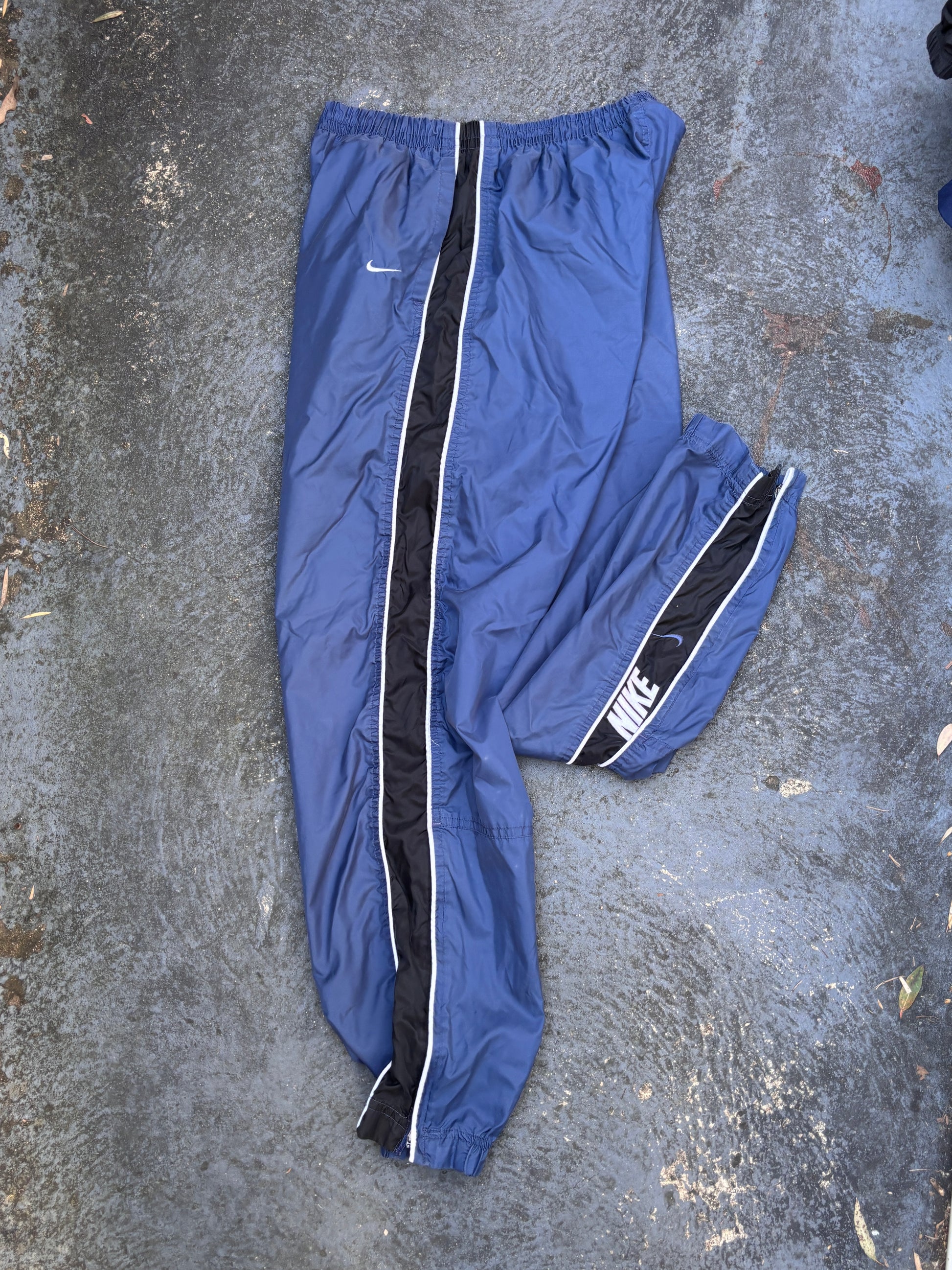 Vintage 90s Nike Track Pants Size L Blue Black Detail Spell Out Swoosh Wide Leg Ankle Zip
