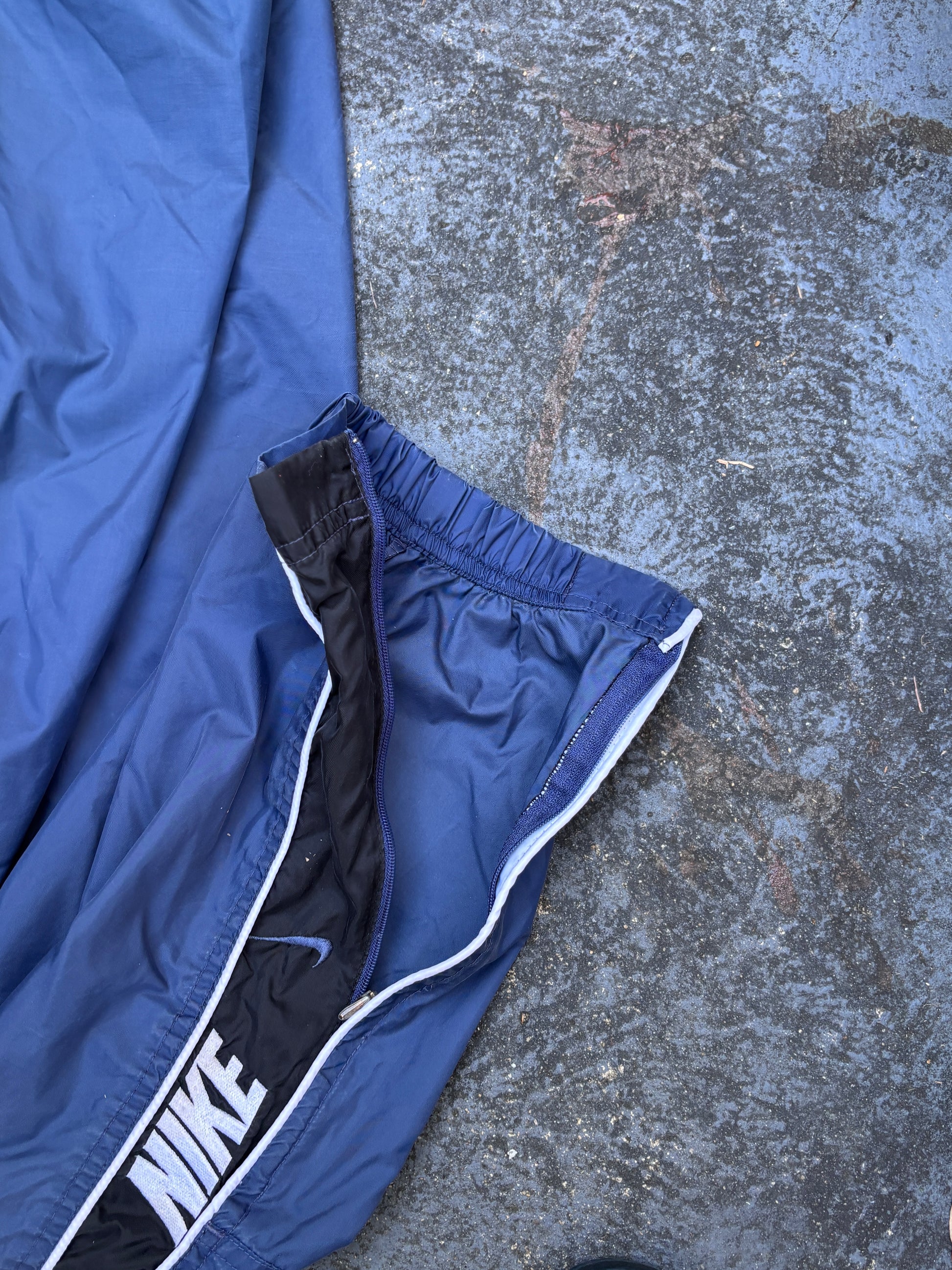 Vintage 90s Nike Track Pants Size L Blue Black Detail Spell Out Swoosh Wide Leg Ankle Zip