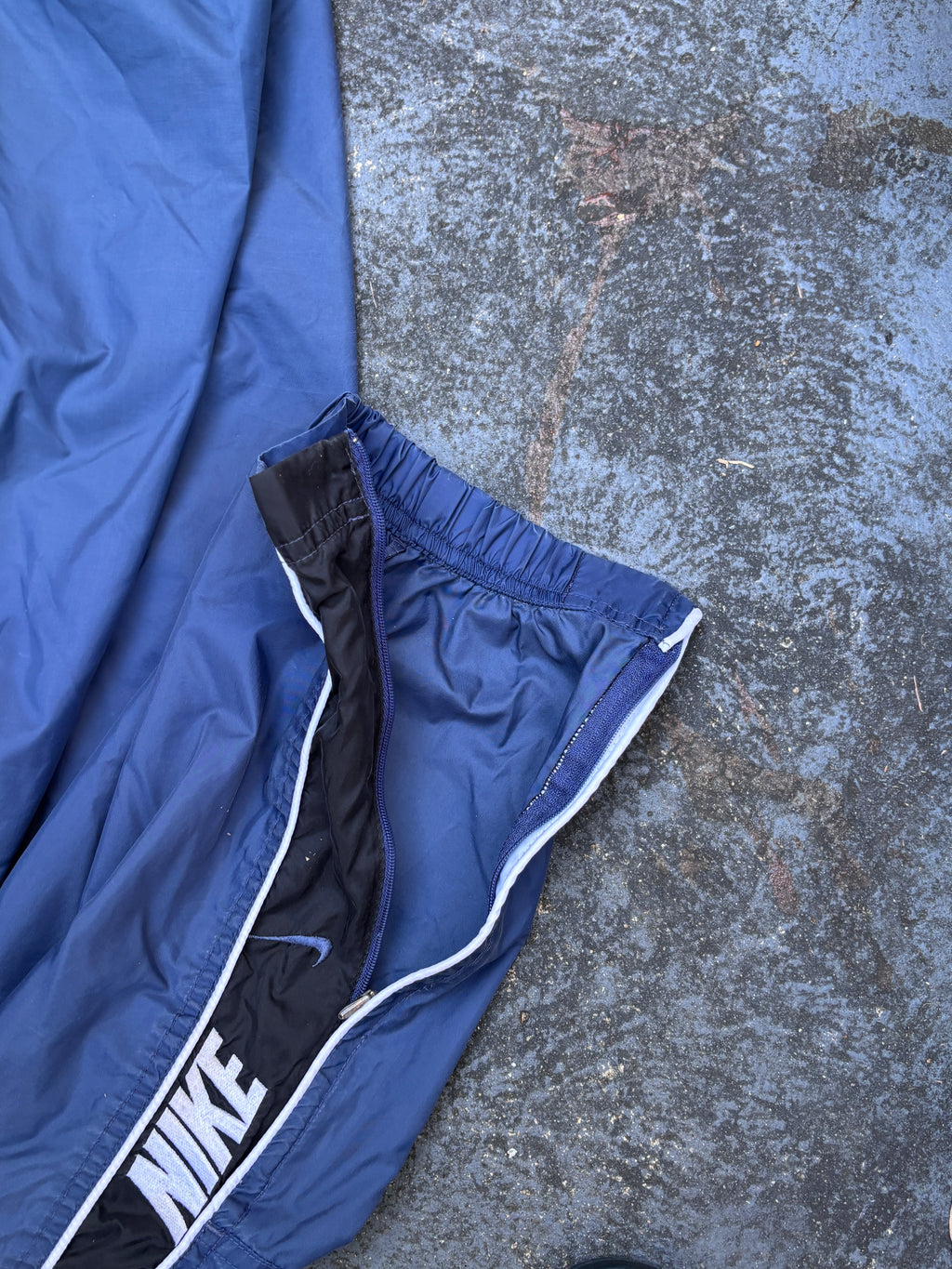 Vintage 90s Nike Track Pants Size L Blue Black Detail Spell Out Swoosh Wide Leg Ankle Zip