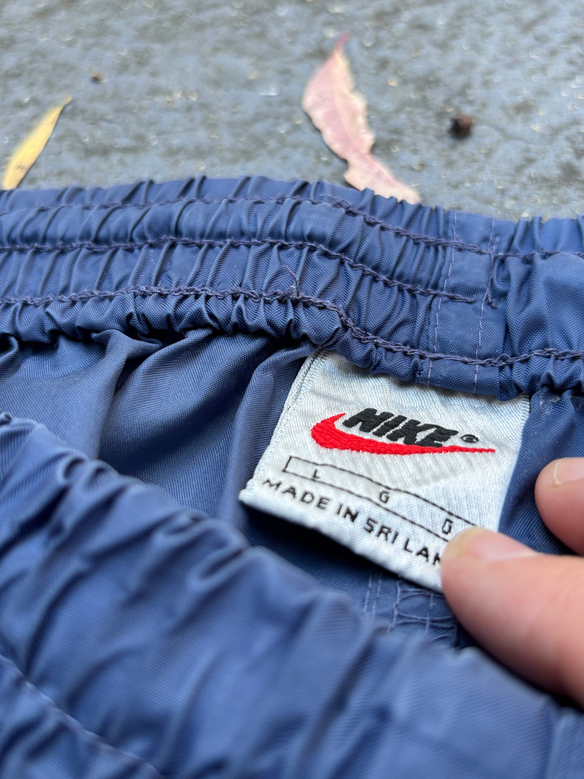 Vintage 90s Nike Track Pants Size L Blue Black Detail Spell Out Swoosh Wide Leg Ankle Zip