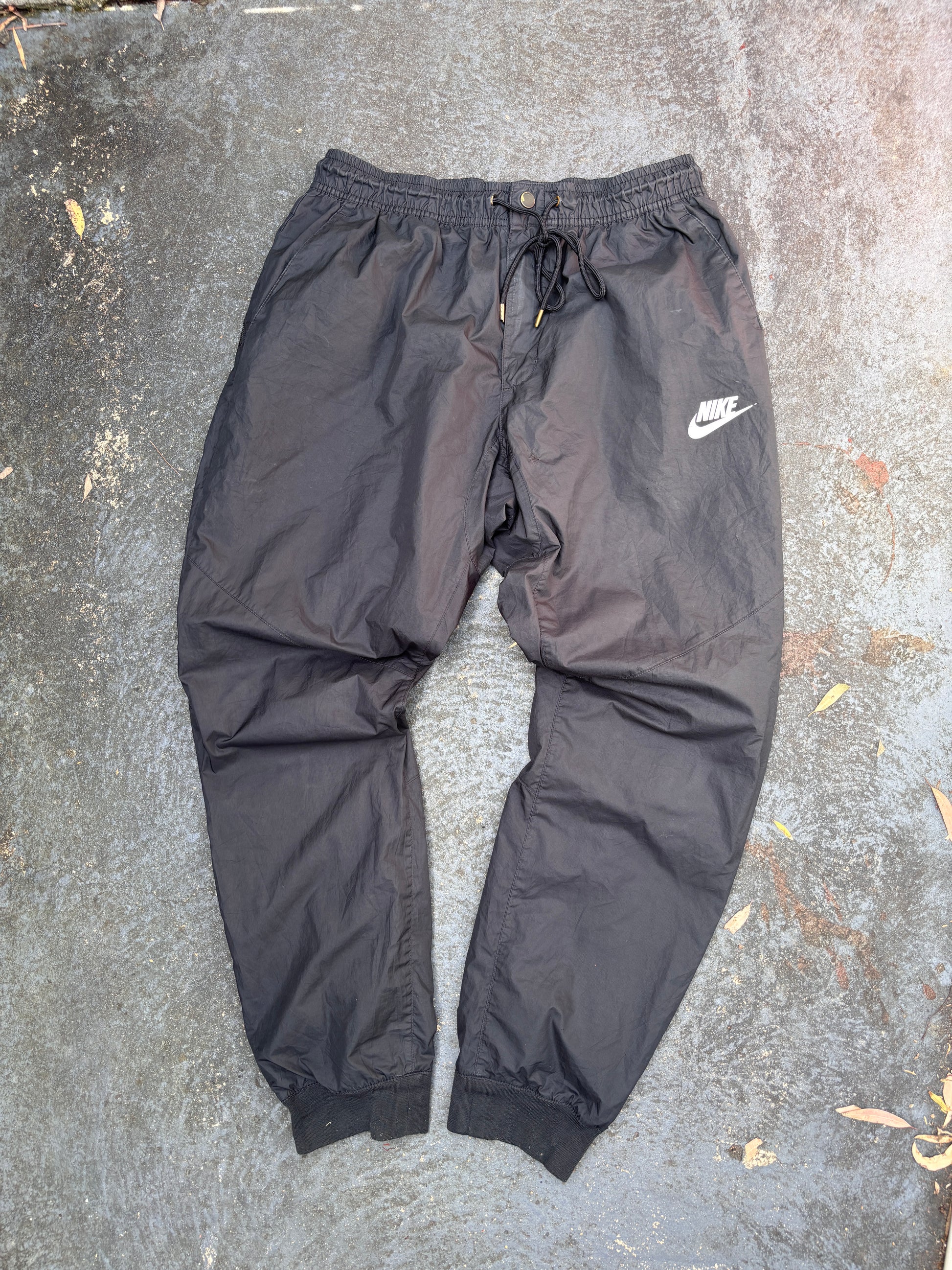 Nike Track Pants Women’s Size L Black Hip Logo Tapered Button Zip Drawstring