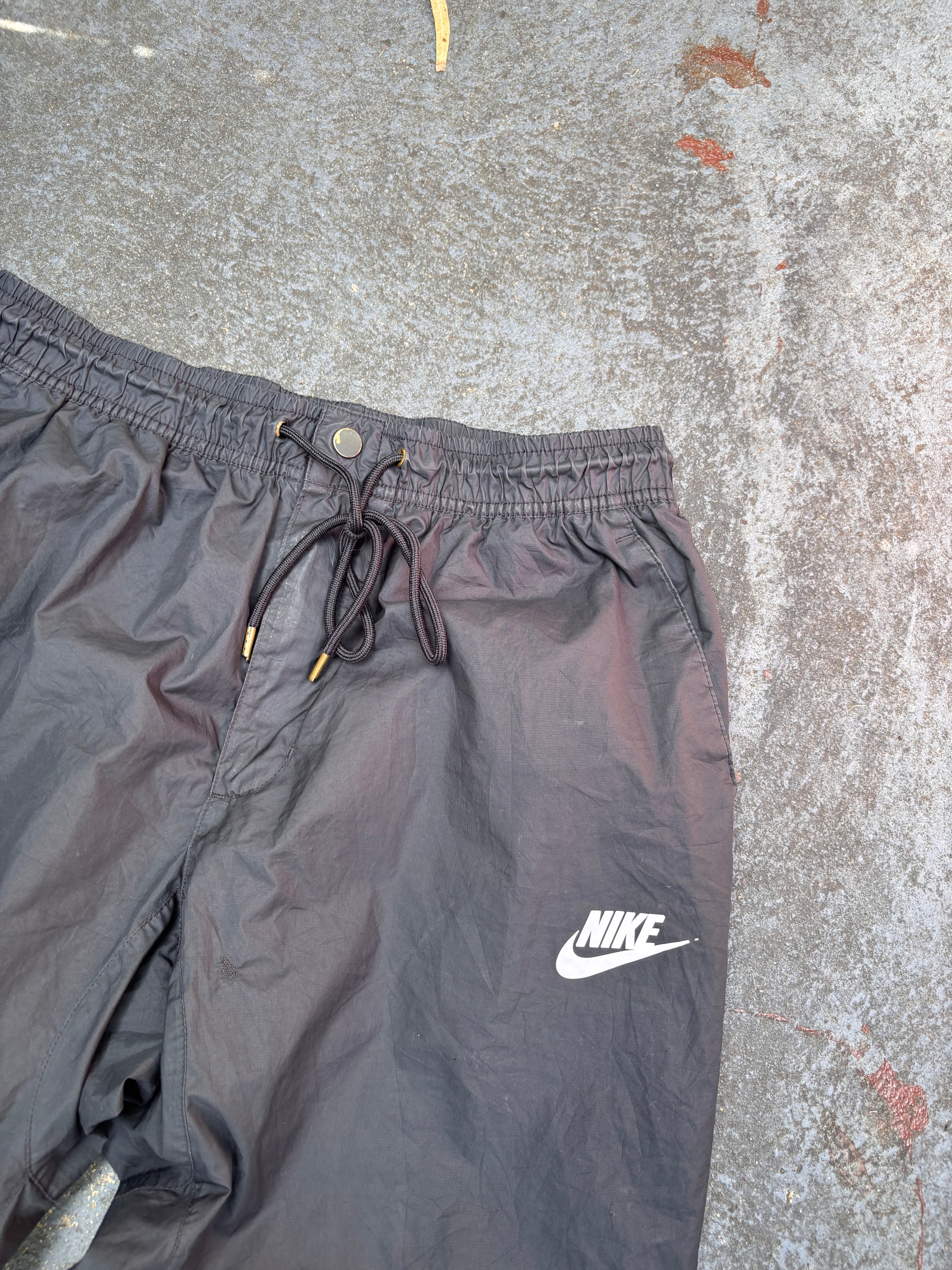 Nike Track Pants Women’s Size L Black Hip Logo Tapered Button Zip Drawstring