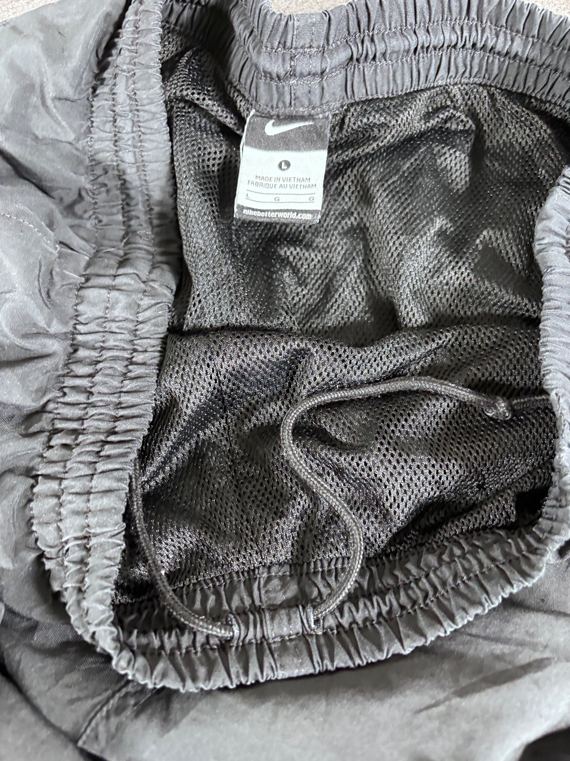 Vintage Late Y2K / 10s Nike Track Pants Size L Black White Swoosh Wide Leg Ankle Zip