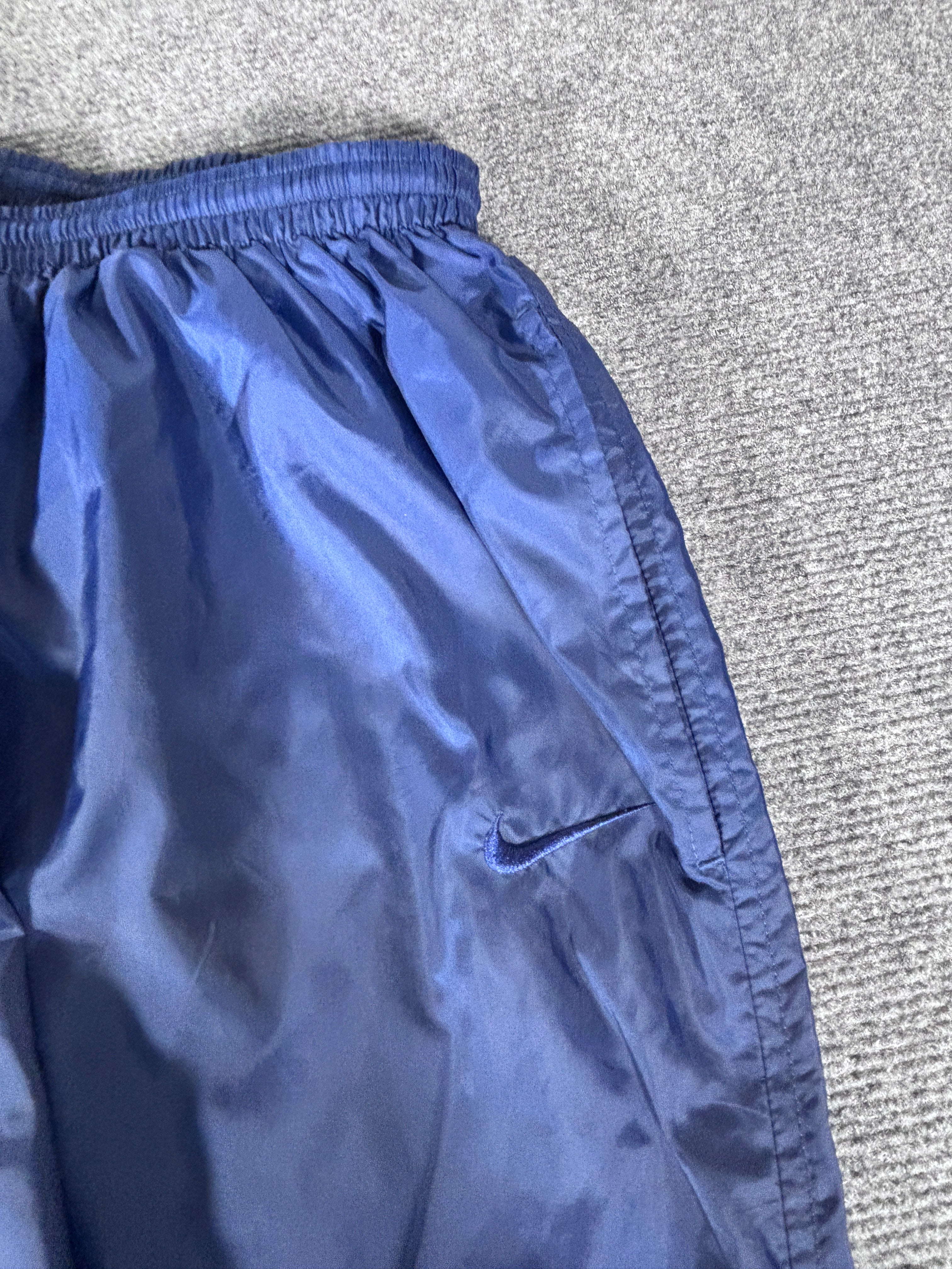 navy blue nike windbreaker pants
