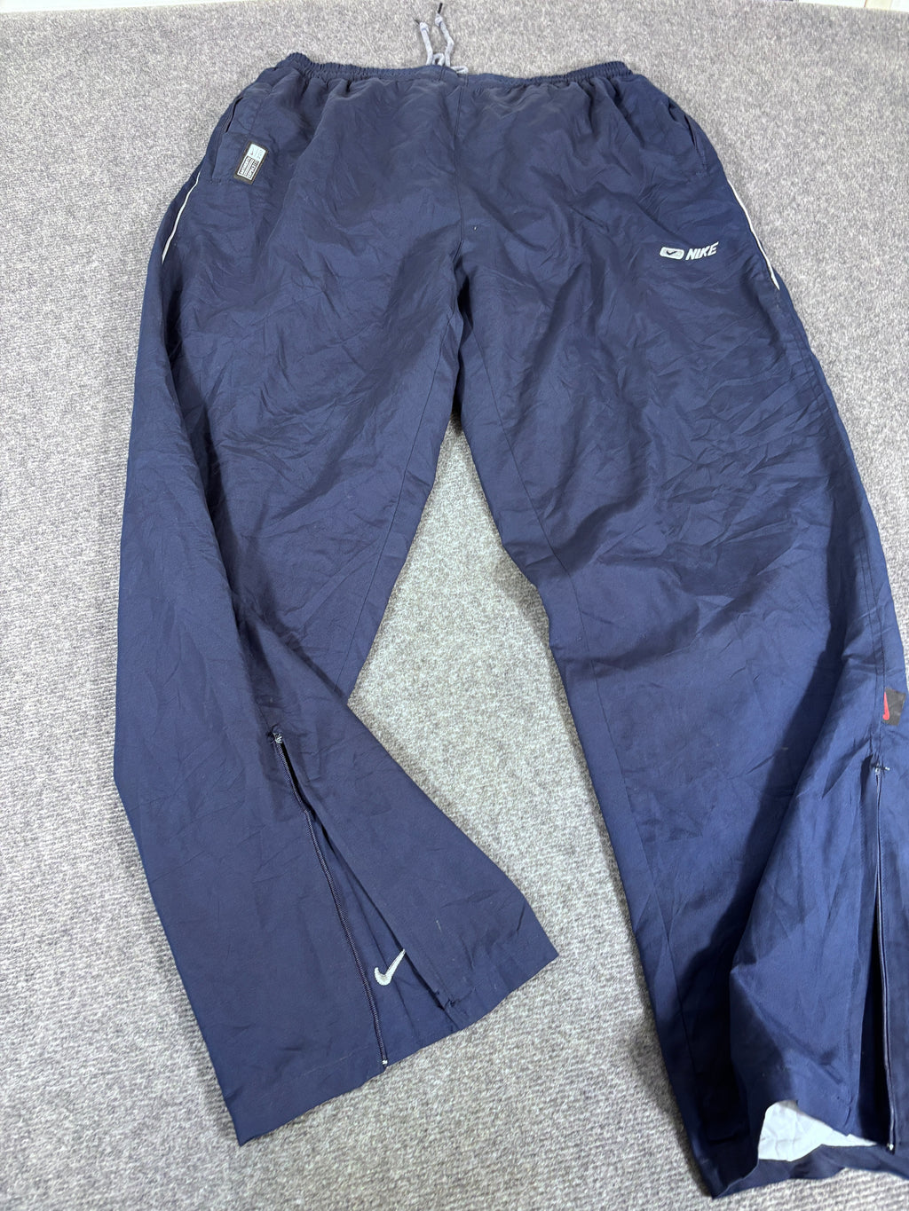 Vintage 90s Nike Track Pants Size XL Navy Badge Swoosh Spell Out Wide Leg Ankle Zip