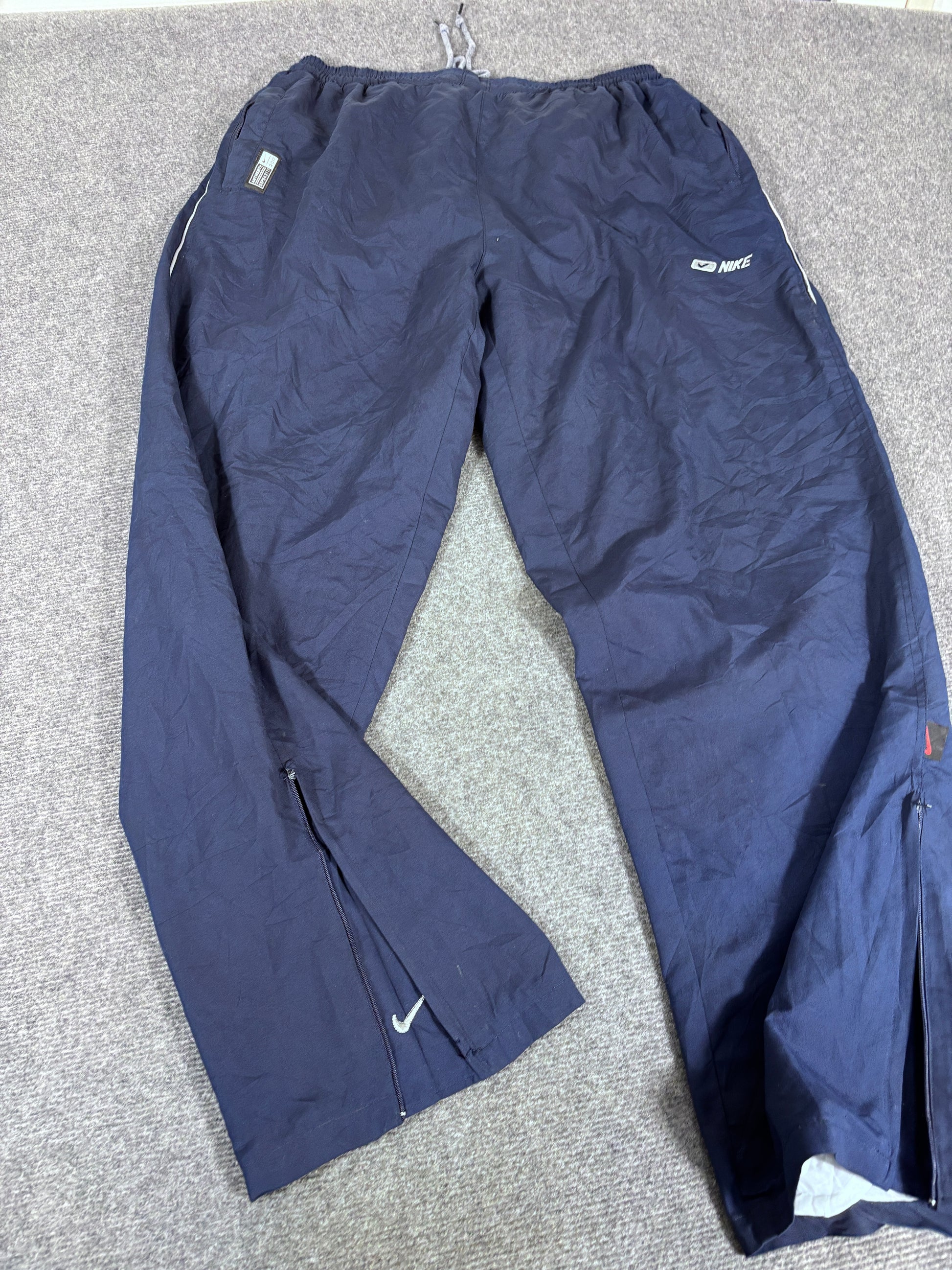 Vintage 90s Nike Track Pants Size XL Navy Badge Swoosh Spell Out Wide Leg Ankle Zip