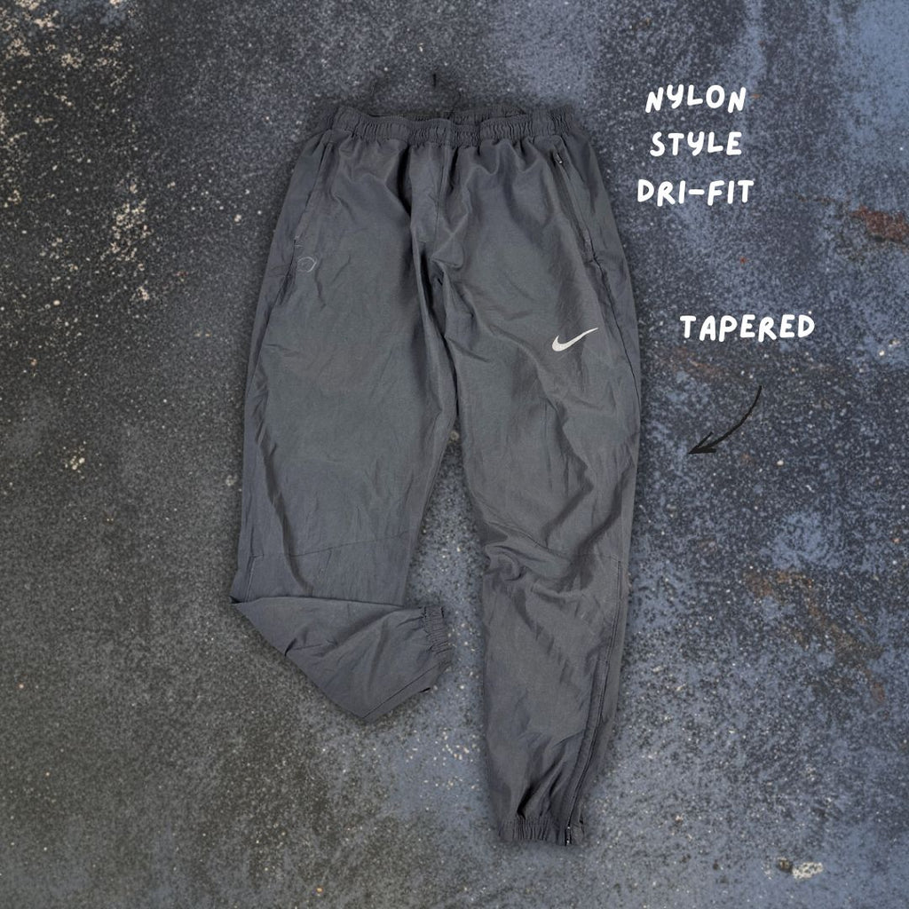 Nike Dri-fit Track Pants L Black Swoosh Tapered Leg Ankle Zip